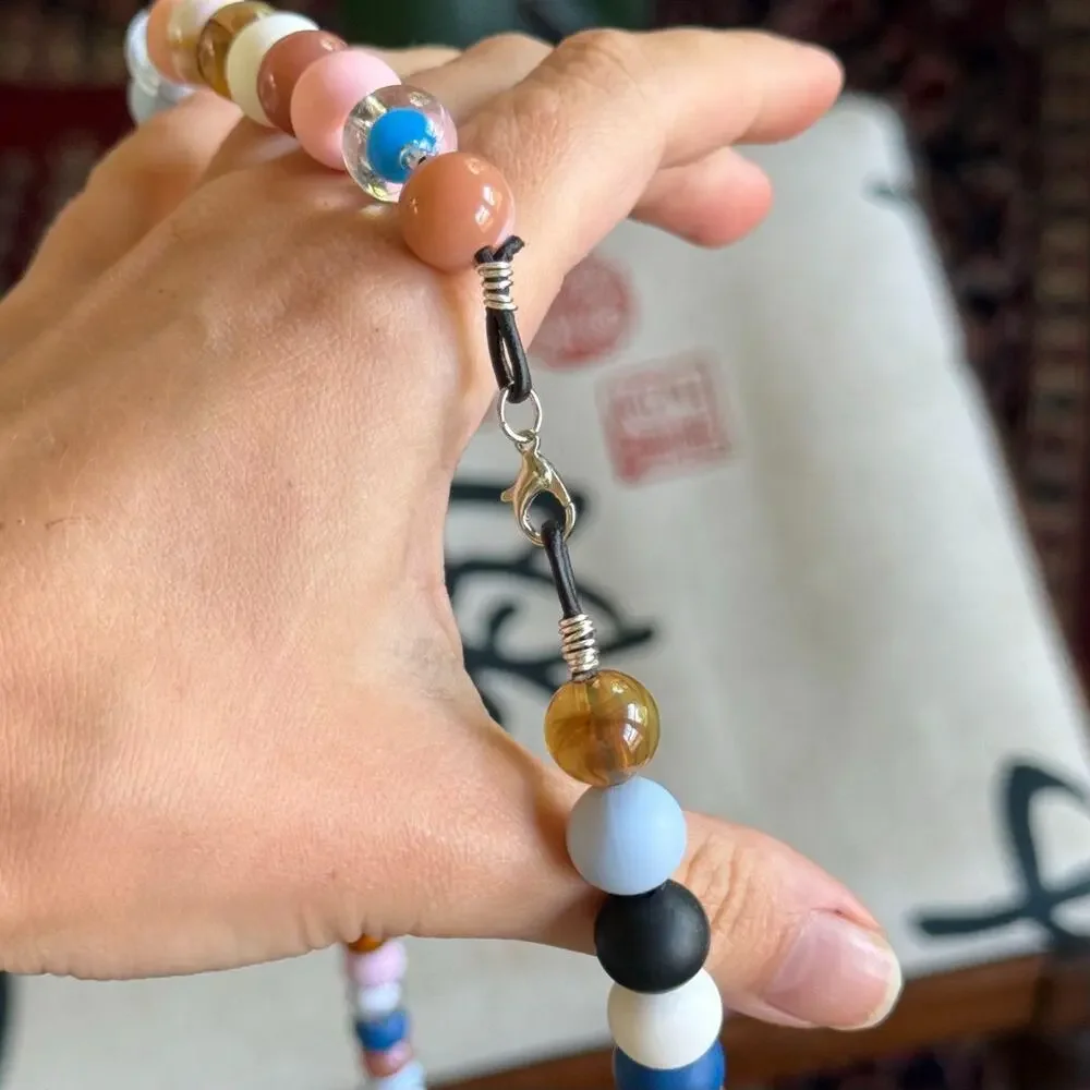 handmade lanyard with black leather cord and colorful round beads